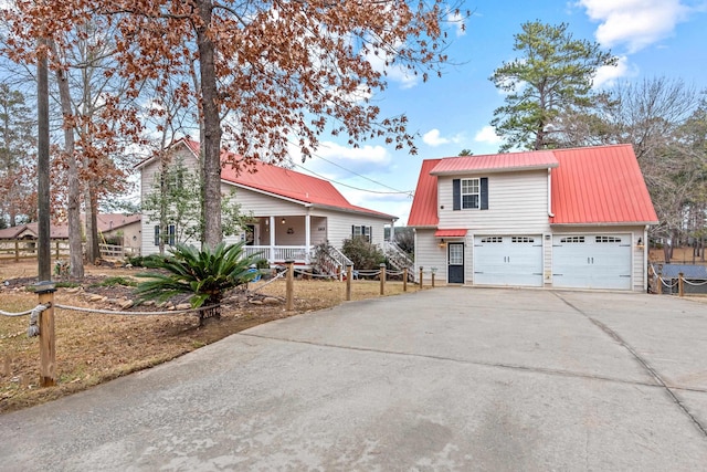 view of front of home featuring a garage and covered porch