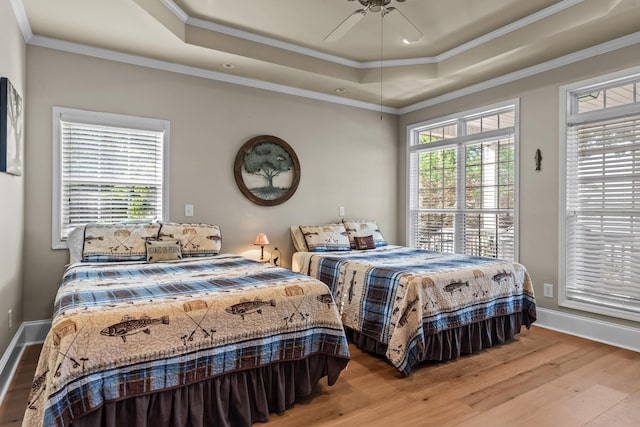 163 Knight Dr, Milledgeville, GA 31061 - bedroom with a raised ceiling, wood finished floors, baseboards, and ornamental molding