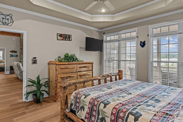 163 Knight Dr, Milledgeville, GA 31061 - bedroom with a raised ceiling, light wood-style flooring, crown molding, baseboards, and a ceiling fan