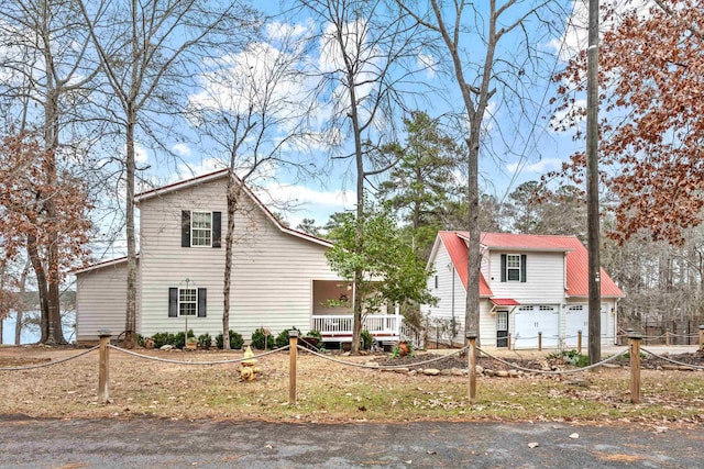 view of front of property featuring a garage and covered porch