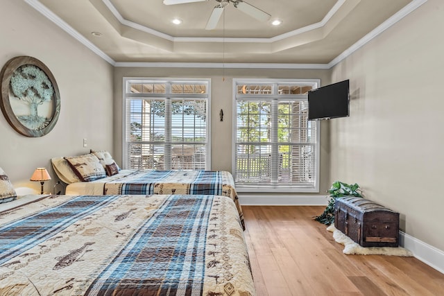 163 Knight Dr, Milledgeville, GA 31061 - bedroom featuring a tray ceiling, wood finished floors, crown molding, baseboards, and recessed lighting
