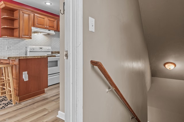 staircase featuring hardwood / wood-style flooring