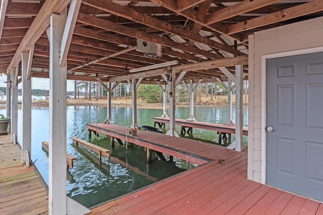 dock area with a water view