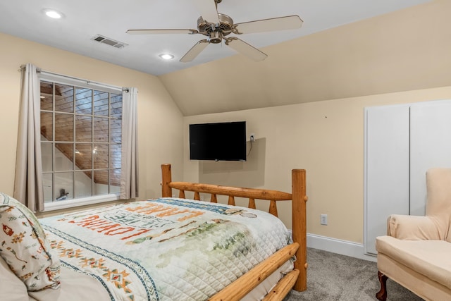 bedroom with vaulted ceiling, ceiling fan, and carpet floors