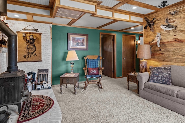 living room with a wood stove and light carpet