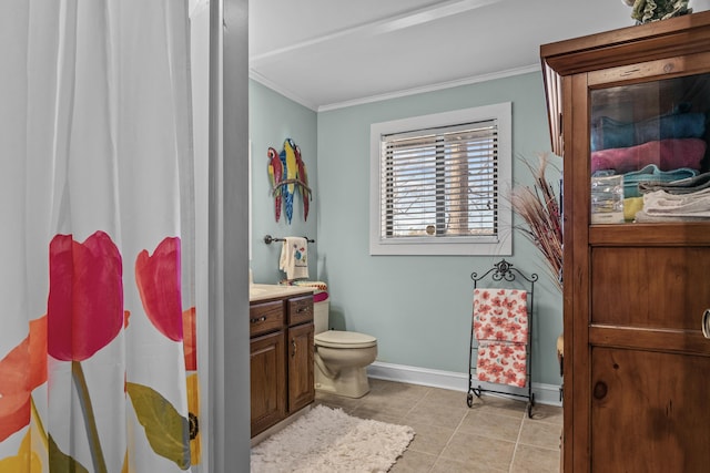 bathroom with ornamental molding, toilet, tile patterned flooring, and vanity