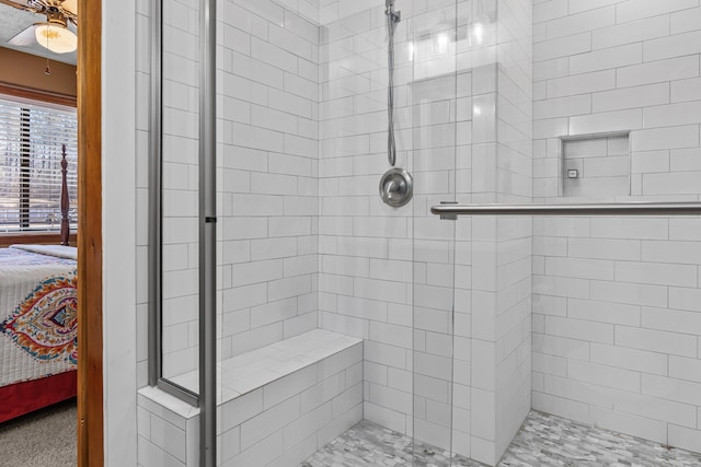 bathroom featuring a shower with shower door