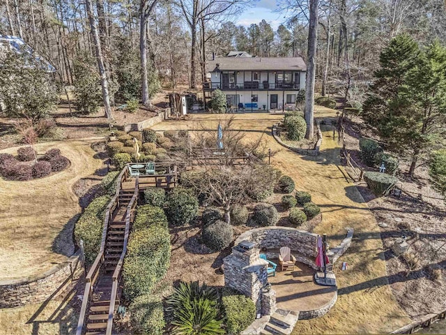 back of house with a patio area and a fire pit