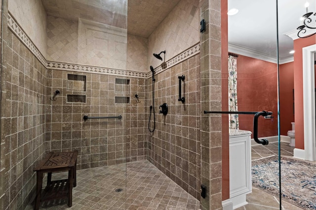 bathroom featuring tile patterned flooring, a shower with door, ornamental molding, and toilet