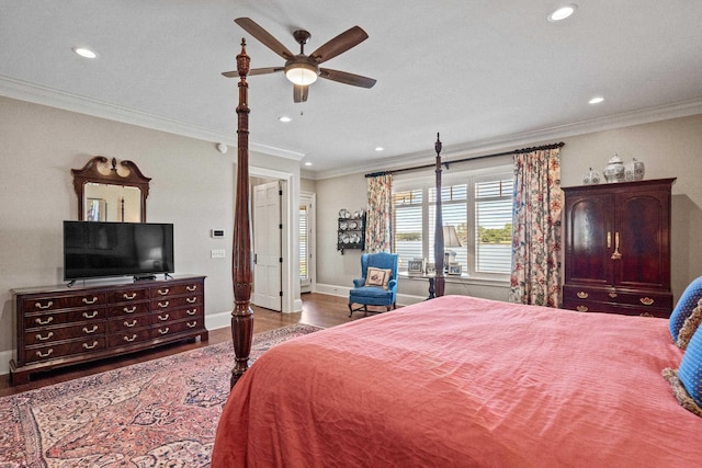 bedroom with hardwood / wood-style floors, crown molding, and ceiling fan