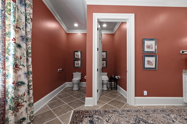 bathroom featuring tile patterned flooring, ornamental molding, and toilet