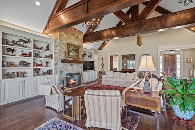 living room with dark hardwood / wood-style floors, beamed ceiling, a fireplace, and a notable chandelier