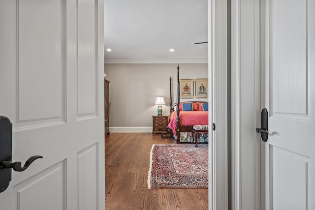 bedroom featuring ornamental molding and hardwood / wood-style floors