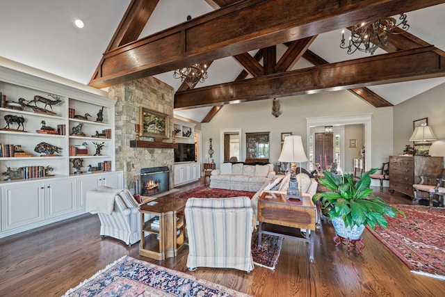 living room featuring dark hardwood / wood-style flooring, a fireplace, a chandelier, and beam ceiling