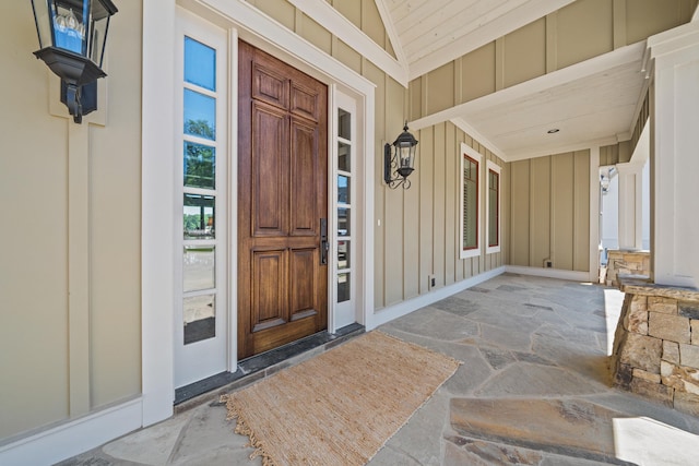 view of exterior entry featuring a porch