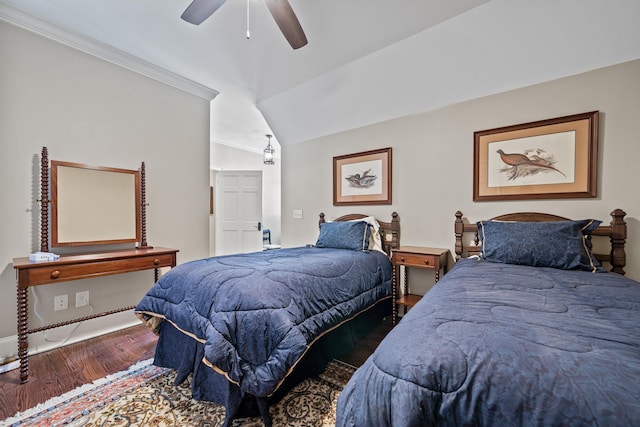 bedroom with hardwood / wood-style flooring, vaulted ceiling, crown molding, and ceiling fan