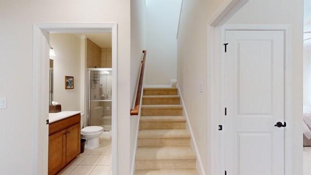 staircase with tile patterned flooring