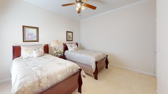 carpeted bedroom featuring ceiling fan and ornamental molding