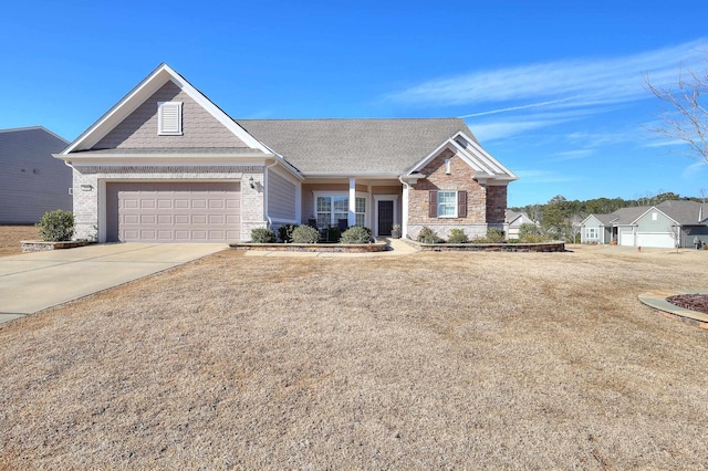 view of front of house featuring a garage and a front lawn