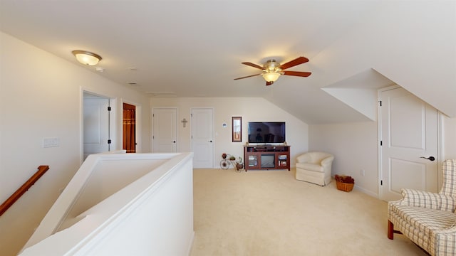 living area featuring vaulted ceiling and carpet flooring