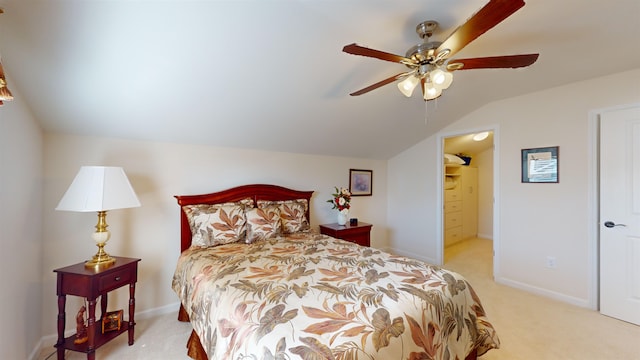 carpeted bedroom featuring vaulted ceiling and ceiling fan