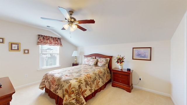 carpeted bedroom with ceiling fan and lofted ceiling