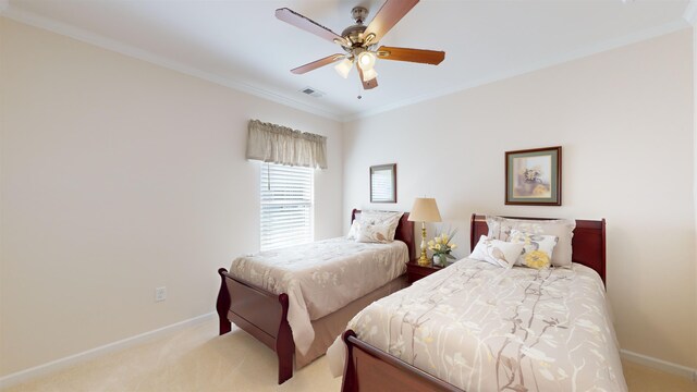 carpeted bedroom featuring ornamental molding and ceiling fan