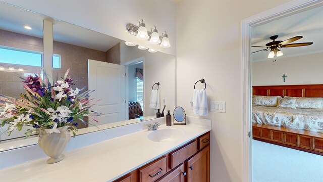 bathroom with ceiling fan, plenty of natural light, and vanity