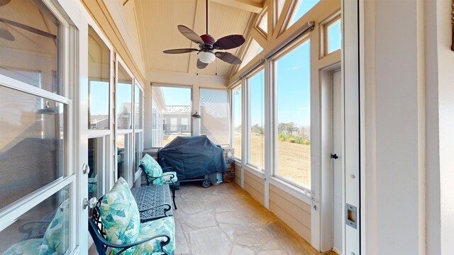 sunroom with wood ceiling and ceiling fan