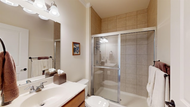 bathroom with vanity, toilet, and walk in shower