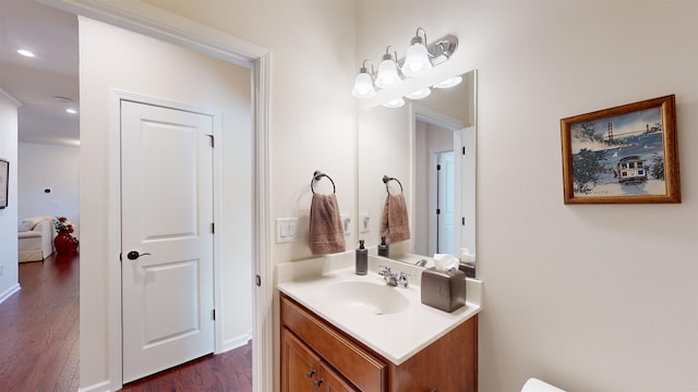 bathroom with vanity and hardwood / wood-style flooring