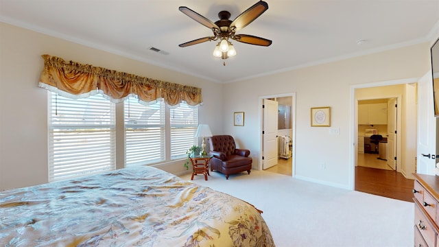 bedroom with light carpet, ornamental molding, and ceiling fan