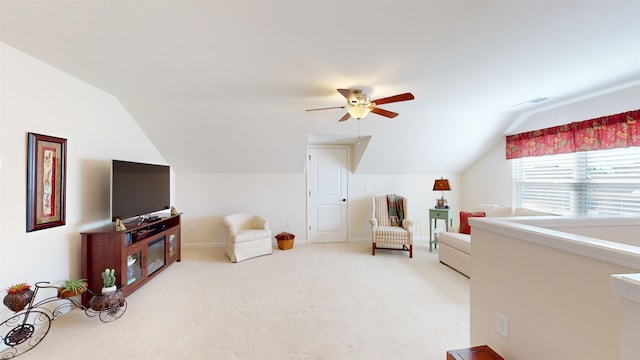 interior space with carpet, lofted ceiling, and ceiling fan