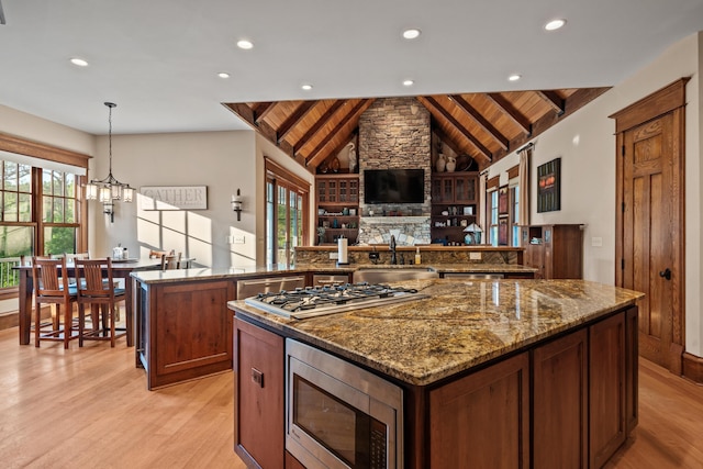 1611 Pine Grove Rd, Greensboro, GA 30642 - kitchen featuring sink, wood ceiling, hanging light fixtures, appliances with stainless steel finishes, and kitchen peninsula