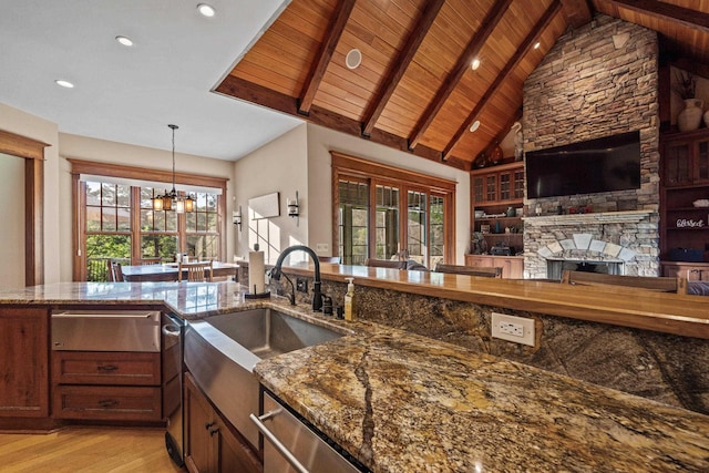 1611 Pine Grove Rd, Greensboro, GA 30642 - kitchen with stone counters, a healthy amount of sunlight, and light wood-type flooring