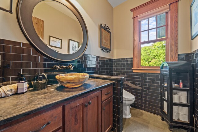 1611 Pine Grove Rd, Greensboro, GA 30642 - bathroom featuring tile patterned flooring, vanity, tile walls, and toilet
