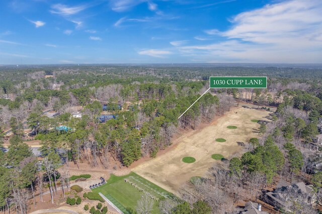 drone / aerial view with a view of trees