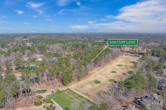 aerial view featuring a view of trees