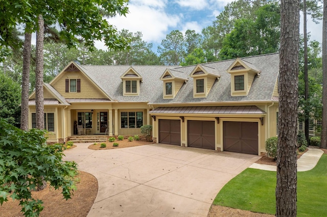 1051 Swift Crk, Greensboro, GA 30642 - view of front of property featuring covered porch, concrete driveway, roof with shingles, and an attached garage