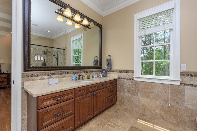 1051 Swift Crk, Greensboro, GA 30642 - full bath with healthy amount of natural light, tile walls, vanity, tiled shower, and crown molding