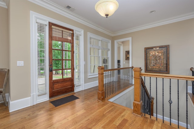 1051 Swift Crk, Greensboro, GA 30642 - foyer entrance featuring crown molding, wood finished floors, and baseboards