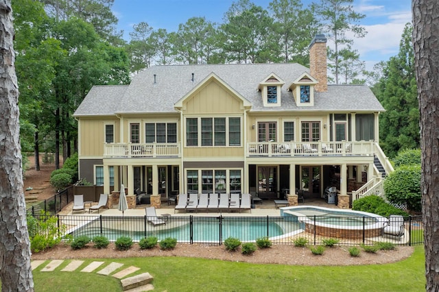 1051 Swift Crk, Greensboro, GA 30642 - back of property featuring a chimney, a patio, a balcony, stairs, and board and batten siding
