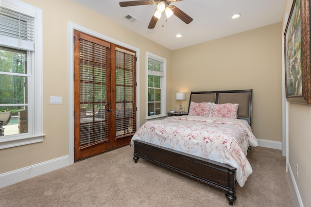 1051 Swift Crk, Greensboro, GA 30642 - bedroom featuring carpet floors, multiple windows, french doors, and recessed lighting