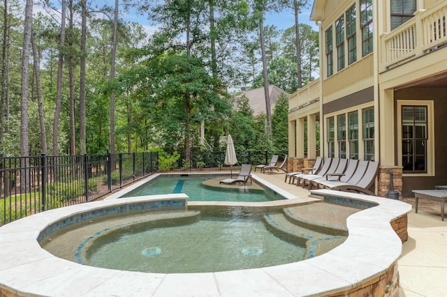 1051 Swift Crk, Greensboro, GA 30642 - view of swimming pool featuring a pool with connected hot tub and a patio area