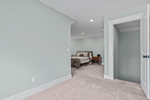 carpeted bedroom with baseboards and recessed lighting