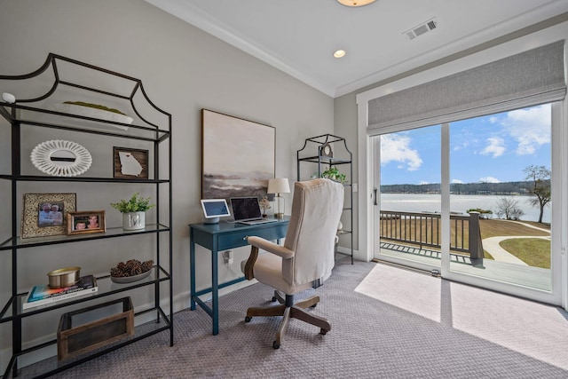 carpeted office featuring crown molding, recessed lighting, visible vents, a water view, and baseboards