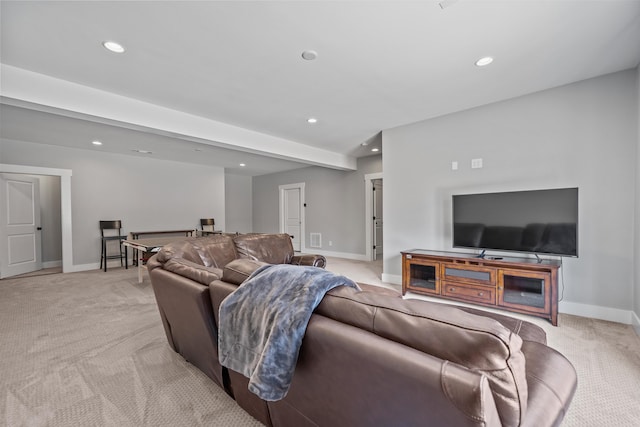 living area with light carpet, baseboards, and recessed lighting