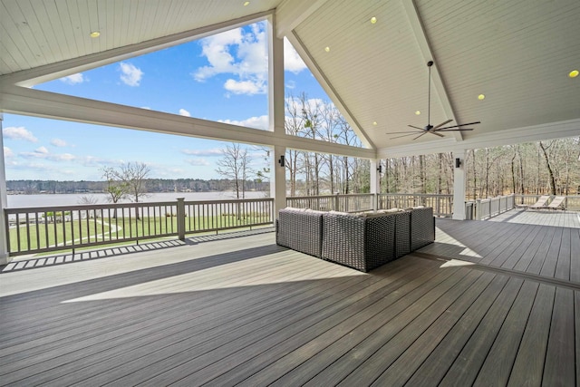 wooden deck featuring a ceiling fan, a water view, and an outdoor hangout area