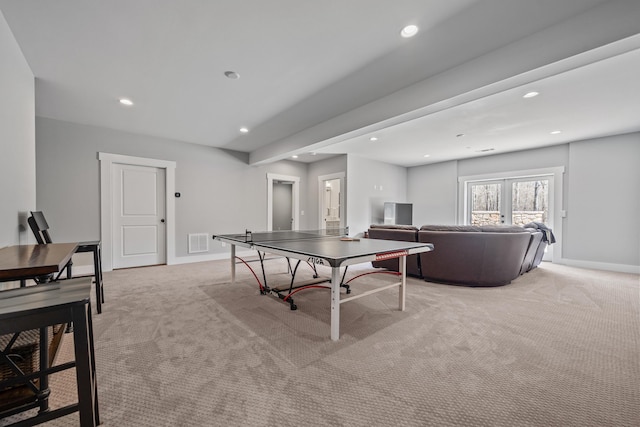 game room with visible vents, light carpet, and baseboards