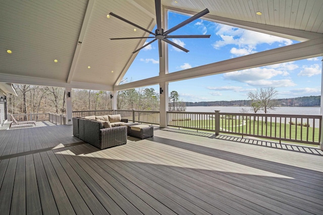 wooden terrace with a water view and an outdoor living space